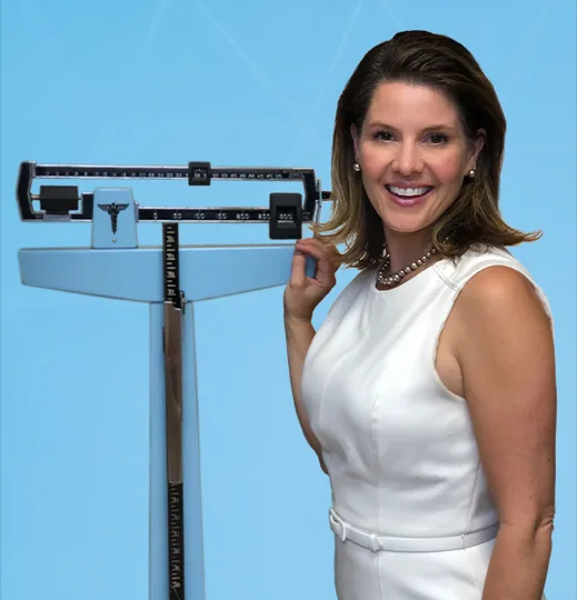 A Meaningful Medicine clinician beside a balance-beam scale